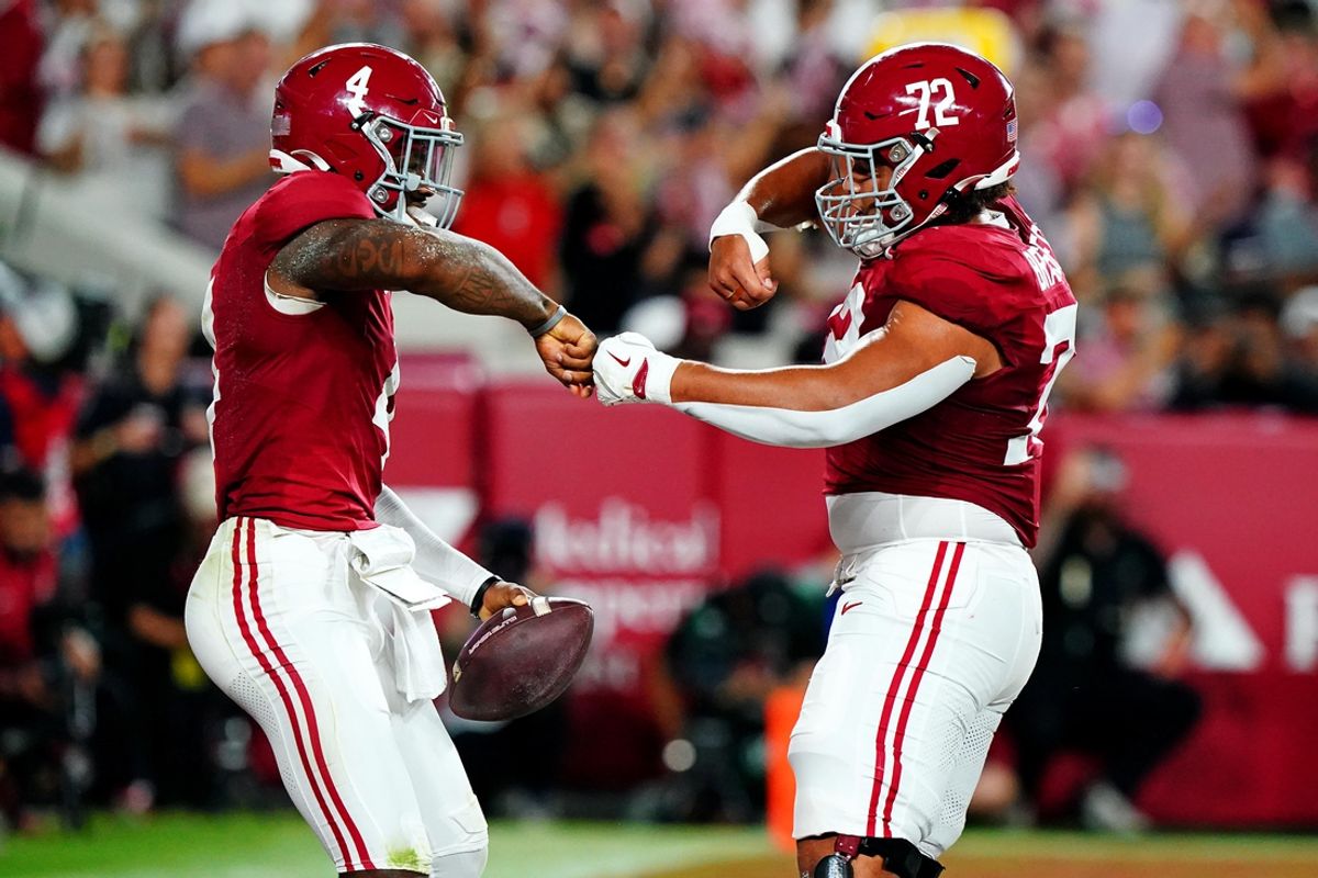 Sep 28, 2024; Tuscaloosa, Alabama, USA; Alabama Crimson Tide quarterback Jalen Milroe (4) celebrates with offensive lineman Parker Brailsford (72) after scoring a touchdown during the first quarter against the Georgia Bulldogs at Bryant-Denny Stadium. Mandatory Credit: John David Mercer-Imagn Images