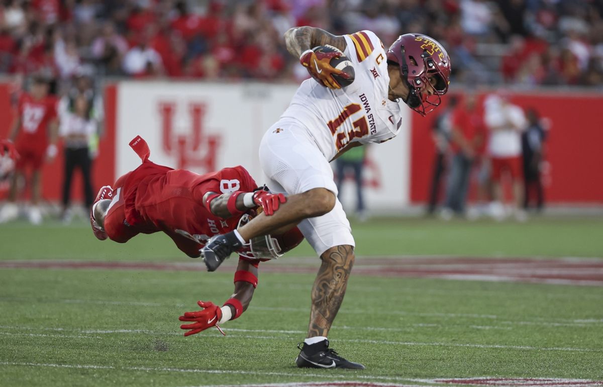 Sep 28, 2024; Houston, Texas, USA; Iowa State Cyclones wide receiver Jaylin Noel (13) runs with the ball as Houston Cougars defensive back Kentrell Webb (8) attempts to make a tackle during the first half at TDECU Stadium. Mandatory Credit: Thomas Shea-Imagn Images