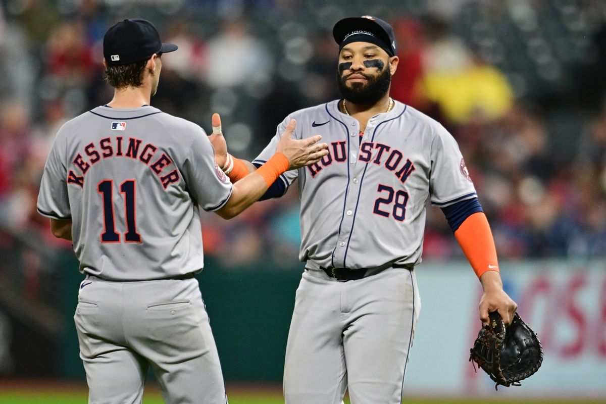 Sep 28, 2024; Cleveland, Ohio, USA; Houston Astros third baseman Grae Kessinger (11) and first baseman Jon Singleton (28) celebrate after the Astros beat the Cleveland Guardians at Progressive Field. Mandatory Credit: Ken Blaze-Imagn Images