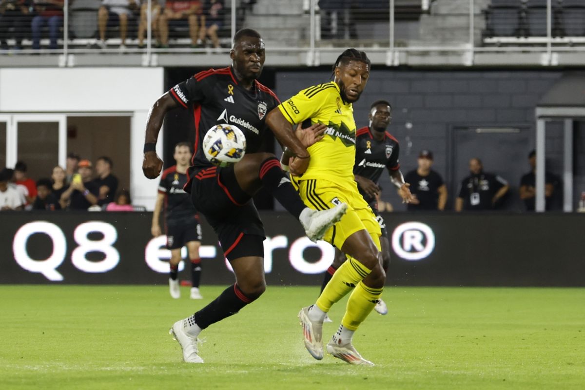 Sep 28, 2024; Washington, District of Columbia, USA; D.C. United forward Christian Benteke (20) and Columbus Crew defender Steven Moreira (31) battle for the ball in the first half at Audi Field. Mandatory Credit: Geoff Burke-Imagn Images