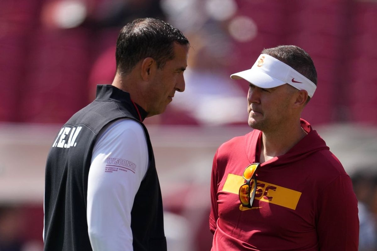 Wisconsin Badgers head coach Luke Fickell (left) and Southern California head coach Lincoln Riley are facing immense pressure to produce a winner this season. Mandatory Credit: Kirby Lee-Imagn Images