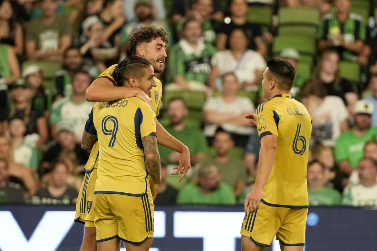 Sep 28, 2024; Austin, Texas, USA; Real Salt Lake midfielder Matt Crooks (25) celebrates with midfielder Braian Ojeda (6) and forward Cristian Arango (9) after scoring a goal against Austin FC in the second half at Q2 Stadium. Mandatory Credit: Scott Wachter-Imagn Images