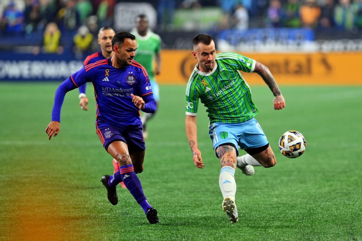 Sep 28, 2024; Seattle, Washington, USA; Seattle Sounders FC midfielder Albert Rusnak (11) and Houston Dynamo FC midfielder Artur (6) go for the ball during the first half at Lumen Field. Mandatory Credit: Steven Bisig-Imagn Images