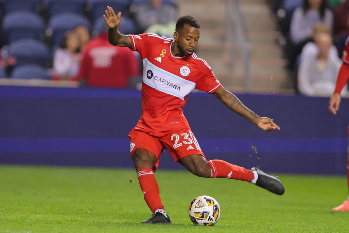 Sep 28, 2024; Chicago, Illinois, USA; Chicago Fire FC midfielder Kellyn Acosta (23) takes a shot during the second half against Toronto FC at SeatGeek Stadium. Mandatory Credit: Melissa Tamez-Imagn Images