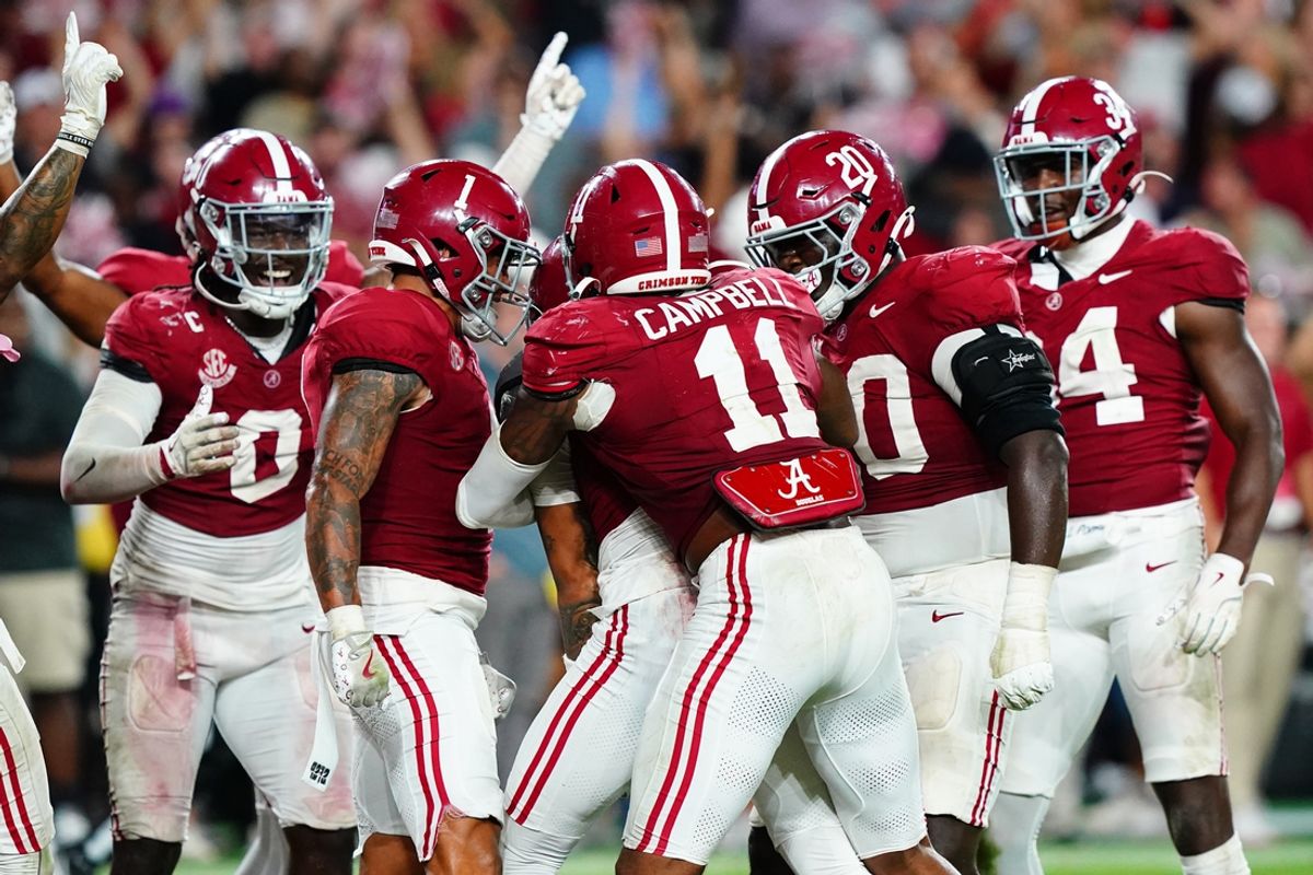 Sep 28, 2024; Tuscaloosa, Alabama, USA;  Members of the Alabama Crimson Tide defensive celebrate after a pass interception by defensive back Zabien Brown (2) to seal a victory over the Georgia Bulldogs during the fourth quarter at Bryant-Denny Stadium. Mandatory Credit: John David Mercer-Imagn Images