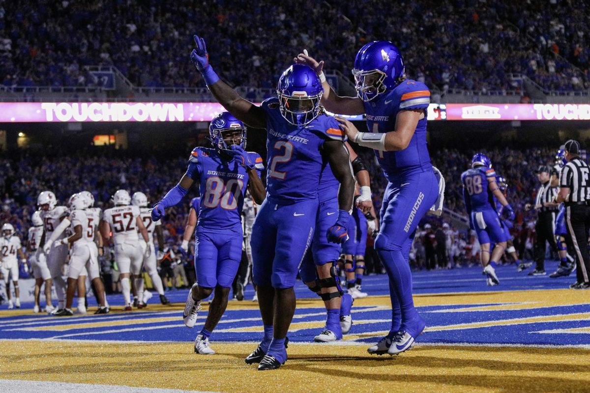 Sep 28, 2024; Boise, Idaho, USA; Boise State Broncos running back Ashton Jeanty (2) and quarterback Maddux Madsen (4) celebrate during the second quarter against the Washington State Cougars at Albertsons Stadium. Mandatory Credit: Brian Losness-Imagn Images