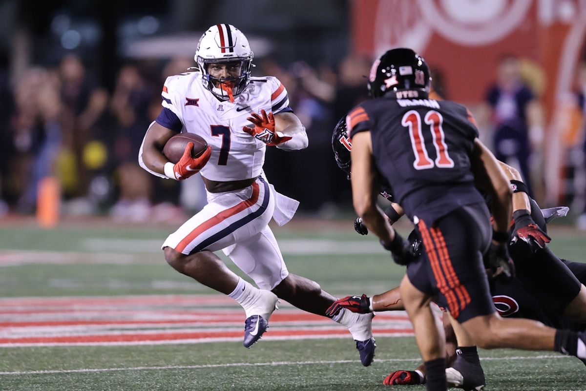 Sep 28, 2024; Salt Lake City, Utah, USA; Arizona Wildcats running back Quali Conley (7) runs against the Utah Utes during the third quarter at Rice-Eccles Stadium. Mandatory Credit: Rob Gray-Imagn Images