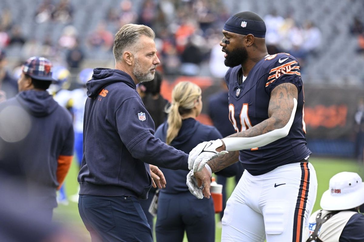 Sep 29, 2024; Chicago, Illinois, USA;  Chicago Bears head coach Matt Eberflus and Chicago Bears tight end Marcedes Lewis (84) before the game against the Los Angeles Rams at Soldier Field. Mandatory Credit: Matt Marton-Imagn Images