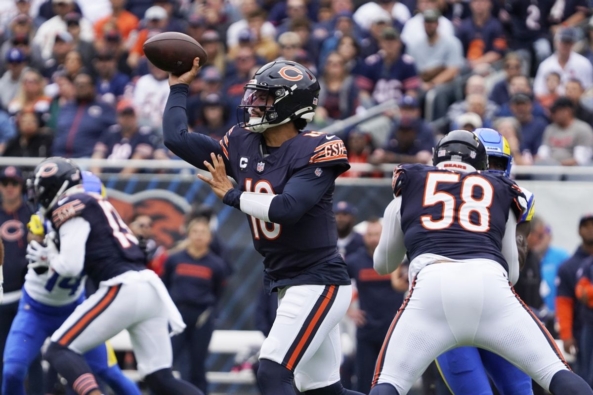 Sep 29, 2024; Chicago, Illinois, USA; Chicago Bears quarterback Caleb Williams (18) passes against the Los Angeles Rams during the first half at Soldier Field. Mandatory Credit: David Banks-Imagn Images