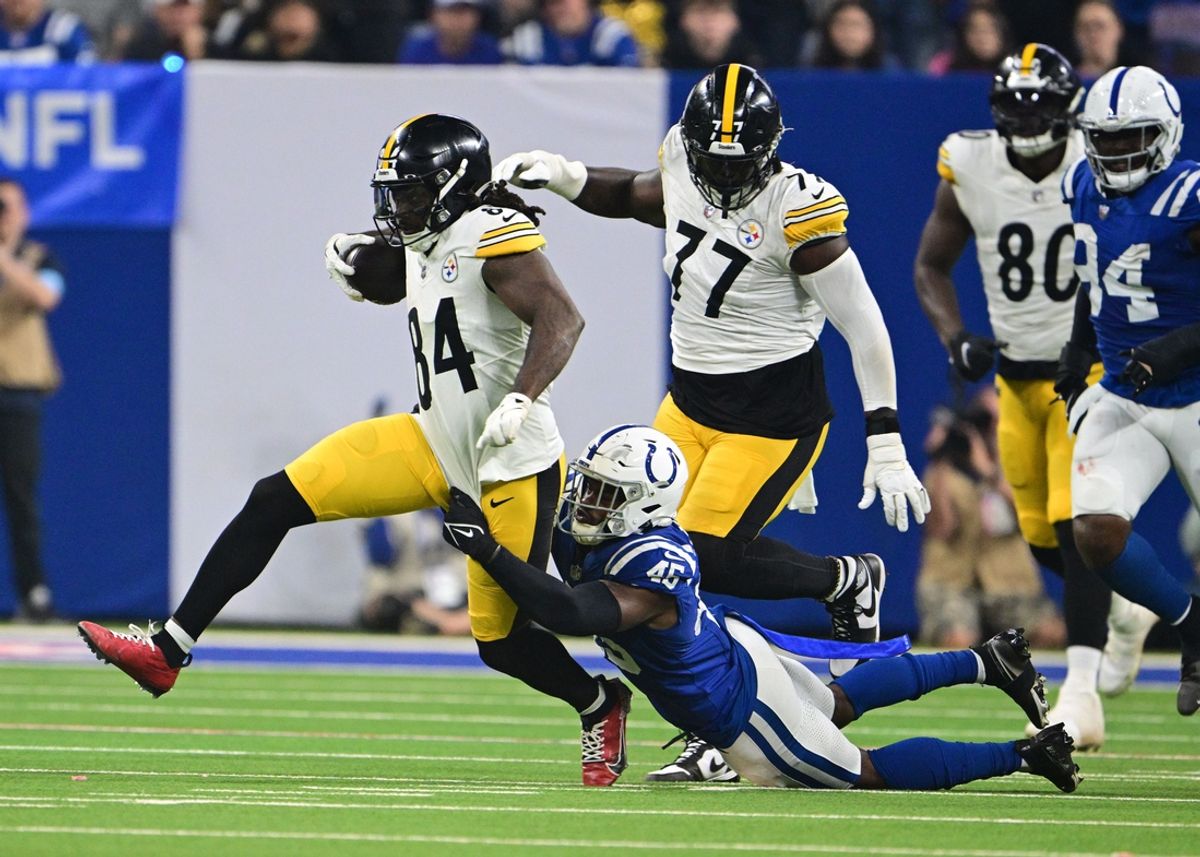 Sep 29, 2024; Indianapolis, Indiana, USA; Pittsburgh Steelers running back Cordarrelle Patterson (84) is tackled by Indianapolis Colts linebacker E.J. Speed (45) during the second quarter at Lucas Oil Stadium. Mandatory Credit: Marc Lebryk-Imagn Images