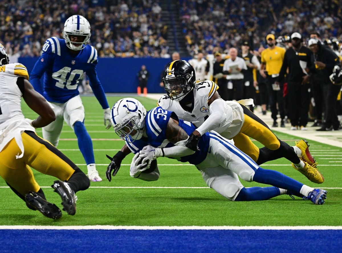 Sep 29, 2024; Indianapolis, Indiana, USA; Indianapolis Colts safety Julian Blackmon (32) recovers a ball fumbled by Pittsburgh Steelers wide receiver George Pickens (14) during the second quarter at Lucas Oil Stadium. Mandatory Credit: Marc Lebryk-Imagn Images