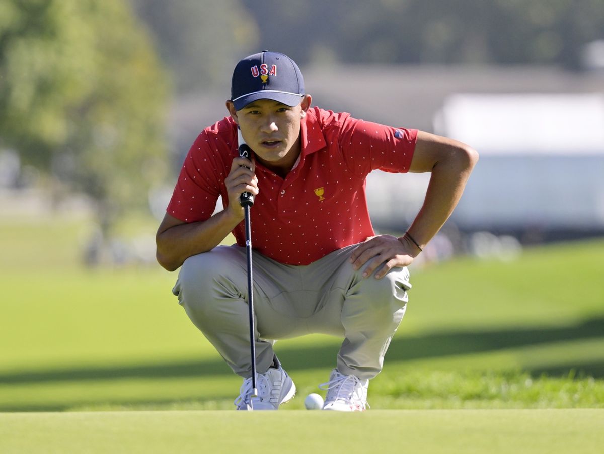 Sep 29, 2024; Ile Bizard, Quebec, CAN; Collin Morikawa of team U.S.A. lines up his putt on the green of the first hole in singles match during the final round of The Presidents Cup golf tournament. Mandatory Credit: Eric Bolte-Imagn Images
