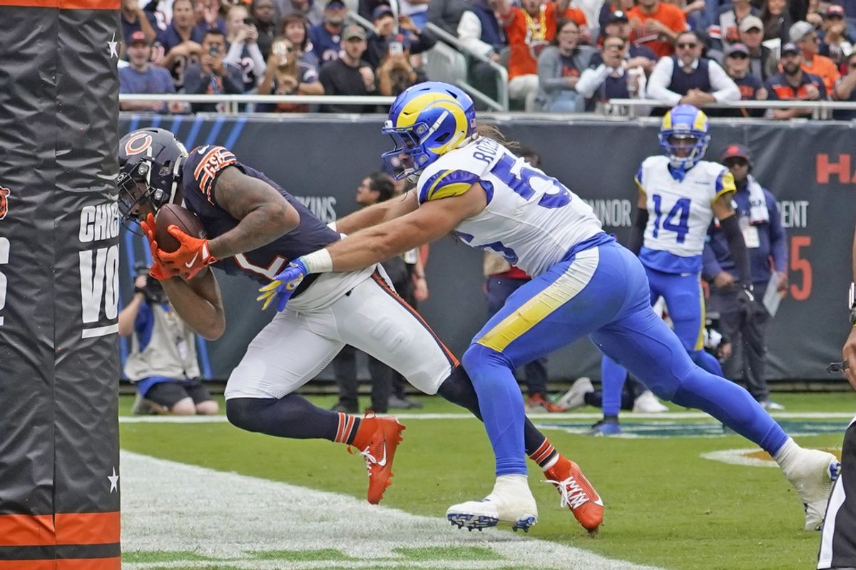 Sep 29, 2024; Chicago, Illinois, USA; Chicago Bears wide receiver DJ Moore (2) catches a touchdown pass as Los Angeles Rams linebacker Christian Rozeboom (56) defends him during the second half at Soldier Field. Mandatory Credit: David Banks-Imagn Images