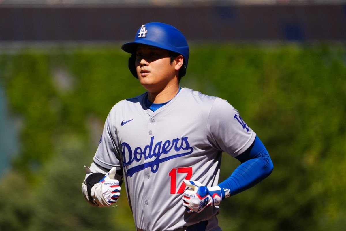 Sep 29, 2024; Denver, Colorado, USA; Los Angeles Dodgers designated hitter Shohei Ohtani (17) leaves the field in the first inning against the Colorado Rockies at Coors Field. Mandatory Credit: Ron Chenoy-Imagn Images