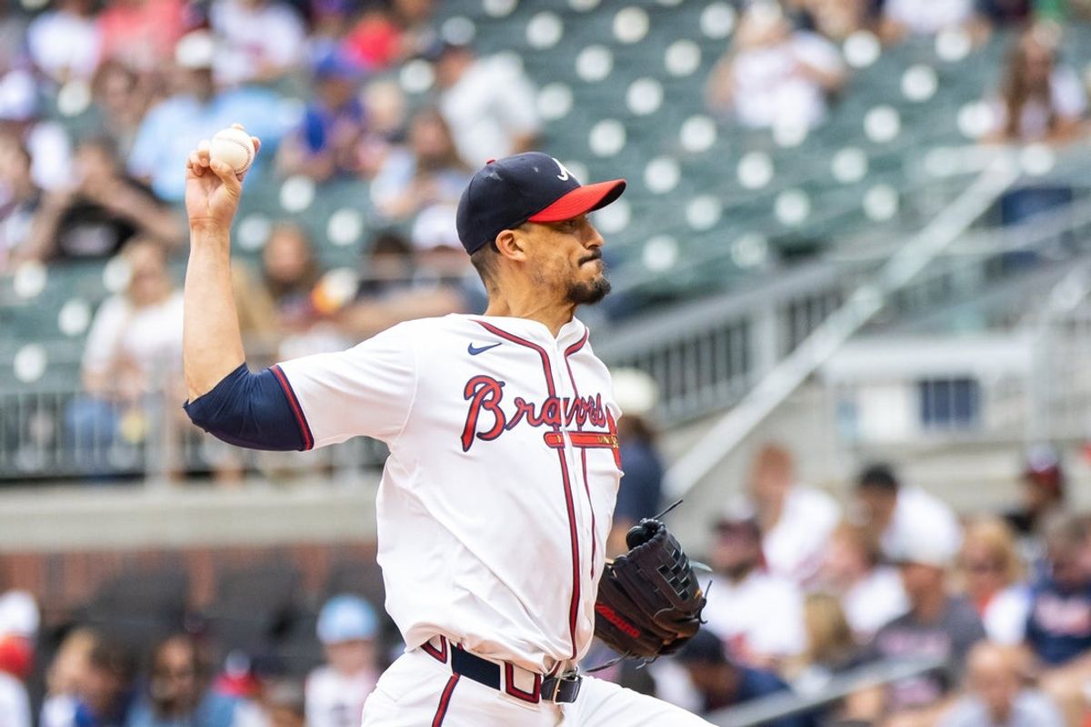 Sep 29, 2024; Cumberland, Georgia, USA; Atlanta Braves pitcher Charlie Morton (50) pitches the ball against the Kansas City Royals during the first inning at Truist Park. Mandatory Credit: Jordan Godfree-Imagn Images