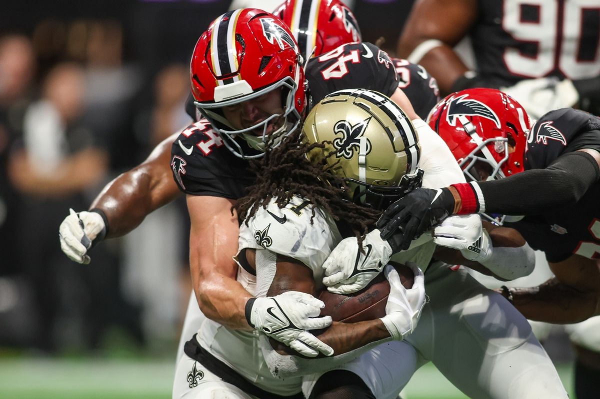 Sep 29, 2024; Atlanta, Georgia, USA; Atlanta Falcons linebacker Troy Andersen (44) tackles New Orleans Saints running back Alvin Kamara (41) in the fourth quarter at Mercedes-Benz Stadium. Mandatory Credit: Brett Davis-Imagn Images