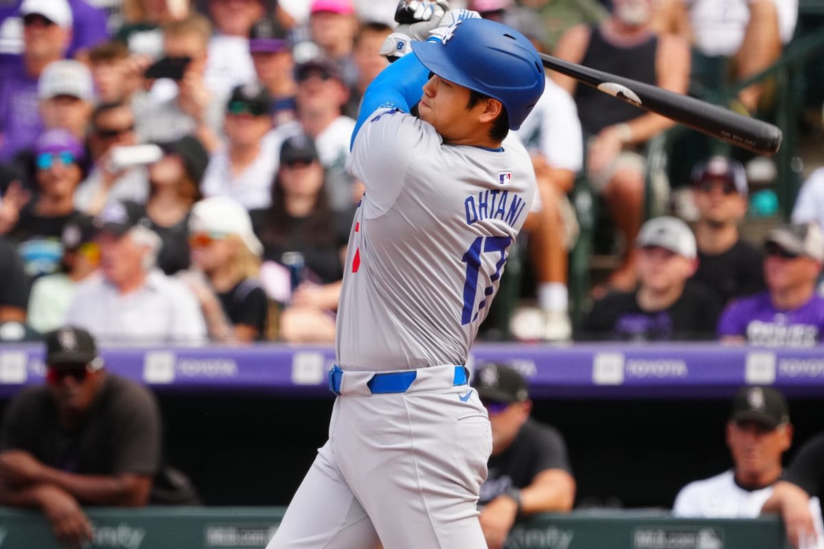 Sep 29, 2024; Denver, Colorado, USA; Los Angeles Dodgers designated hitter Shohei Ohtani (17) singles in the eighth inning against the Colorado Rockies at Coors Field. Mandatory Credit: Ron Chenoy-Imagn Images