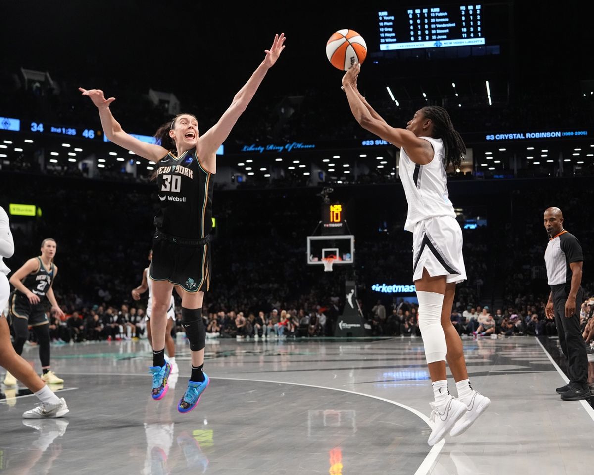 Sep 29, 2024; Brooklyn, New York, USA; Las Vegas Aces guard Tiffany Hayes (15) shoots a three point jump shot over New York Liberty forward Breanna Stewart (30) during game one of the 2024 WNBA Semi-finals at Barclays Center. Mandatory Credit: Gregory Fisher-Imagn Images