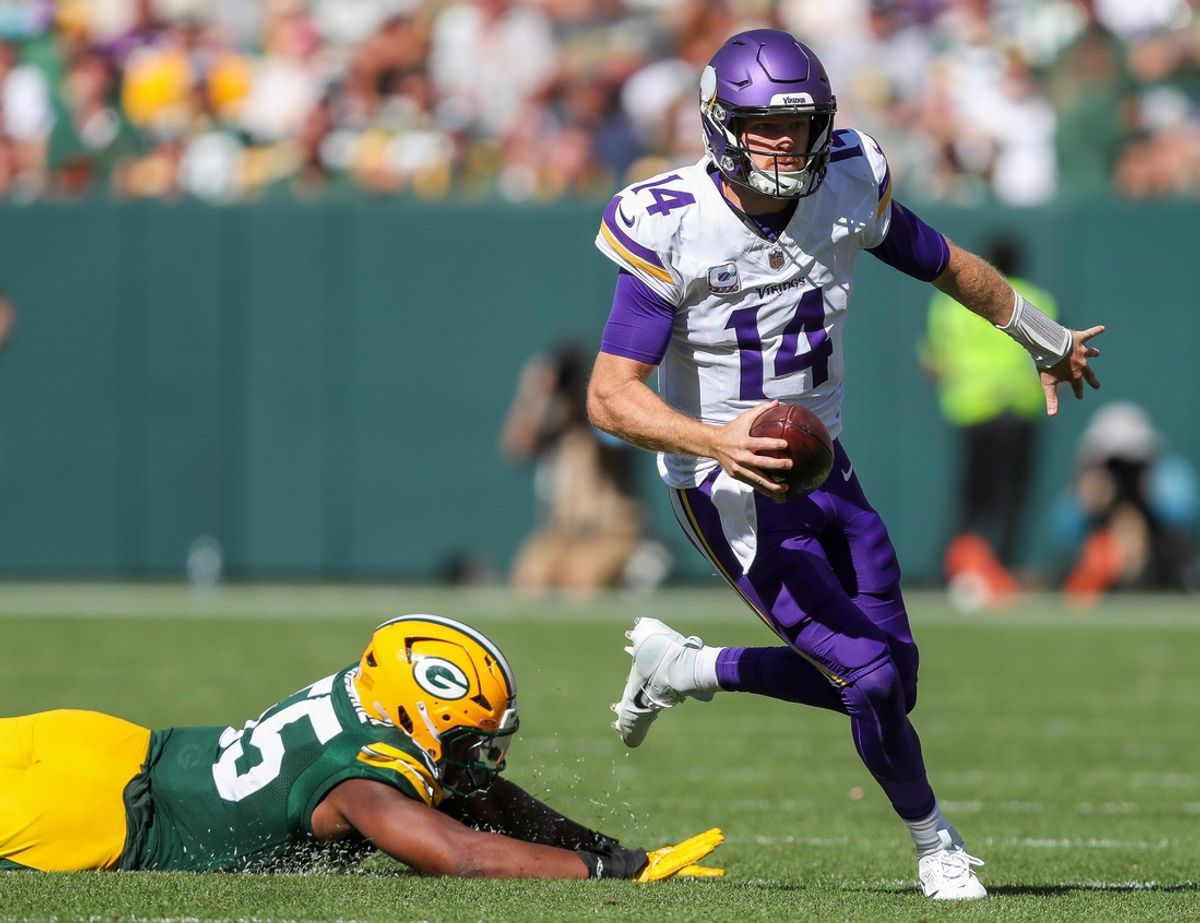 Minnesota Vikings quarterback Sam Darnold (14) escapes from Green Bay Packers defensive end Kingsley Enagbare (55) on Sunday, September 29, 2024, at Lambeau Field in Green Bay, Wis. The Vikings won the game, 31-29.
Tork Mason/USA TODAY NETWORK-Wisconsin