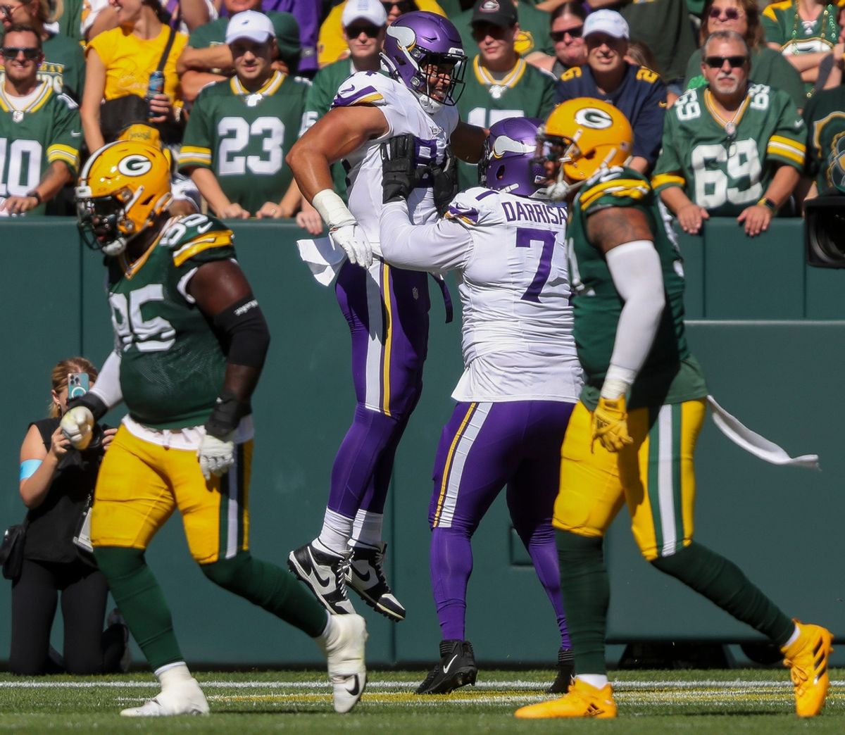 Minnesota Vikings safety Josh Metellus (44) celebrates with offensive tackle Christian Darrisaw (71) after catching a touchdown pass against the Green Bay Packers on Sunday, September 29, 2024, at Lambeau Field in Green Bay, Wis. The Vikings won the game, 31-29.
Tork Mason/USA TODAY NETWORK-Wisconsin