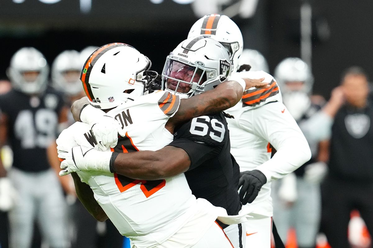 Sep 29, 2024; Paradise, Nevada, USA; Las Vegas Raiders defensive tackle Adam Butler (69) tackles Cleveland Browns quarterback Deshaun Watson (4) during the first quarter at Allegiant Stadium. Mandatory Credit: Stephen R. Sylvanie-Imagn Images