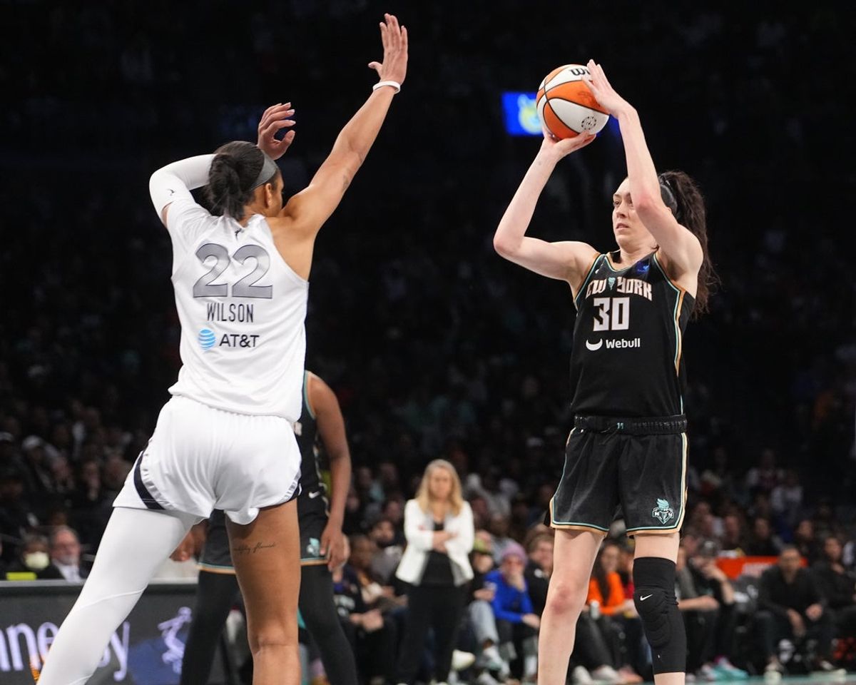 Sep 29, 2024; Brooklyn, New York, USA; New York Liberty forward Breanna Stewart (30) shoots a jump shot over Las Vegas Aces center A'ja Wilson (22) during game one of the 2024 WNBA Semi-finals at Barclays Center. Mandatory Credit: Gregory Fisher-Imagn Images