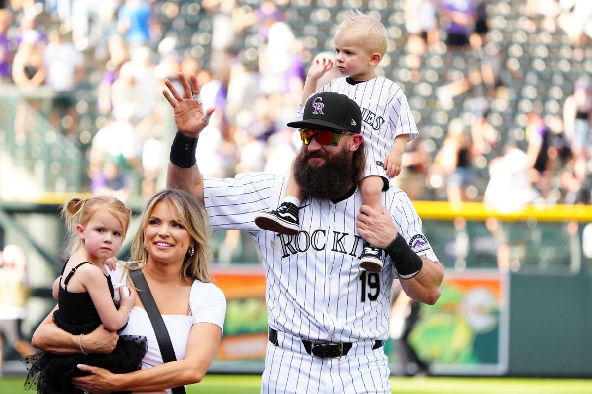 Sep 29, 2024; Denver, Colorado, USA; Colorado Rockies outfielder Charlie Blackmon (19) and wife Ashley and daughter Josie and son Wyatt wave to fans following the loss to the Los Angeles Dodgers at Coors Field. Mandatory Credit: Ron Chenoy-Imagn Images
