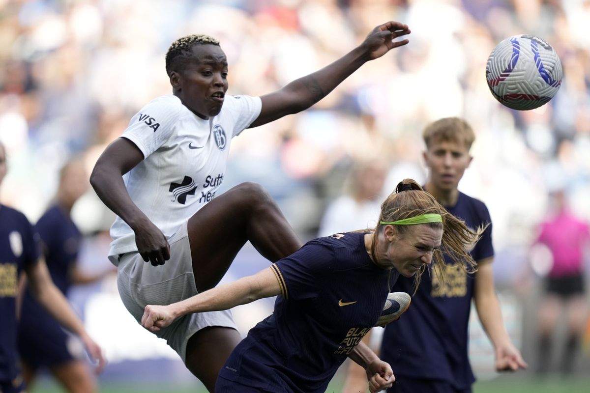 Sep 29, 2024; Seattle, Washington, USA; Bay FC forward Racheal Kundananji (9) and Seattle Reign FC forward Veronica Latsko (24) attempt to get to the ball during the first half at Lumen Field. Mandatory Credit: Stephen Brashear-Imagn Images
