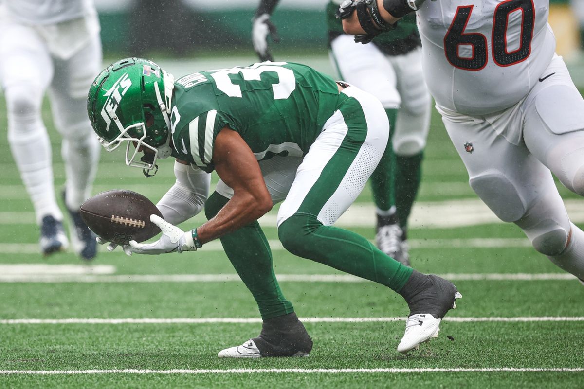 Sep 29, 2024; East Rutherford, New Jersey, USA; New York Jets cornerback Michael Carter II (30) recovers a fumbles in front of Denver Broncos center Luke Wattenberg (60) during the first half at MetLife Stadium. Mandatory Credit: Vincent Carchietta-Imagn Images