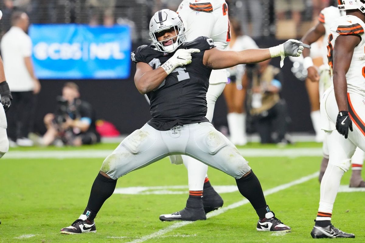 Sep 29, 2024; Paradise, Nevada, USA; Las Vegas Raiders defensive tackle Christian Wilkins (94) celebrates after a penalty overturned a scoring play by the Cleveland Browns during the fourth quarter at Allegiant Stadium. Mandatory Credit: Stephen R. Sylvanie-Imagn Images