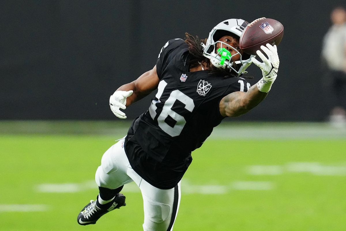 Sep 29, 2024; Paradise, Nevada, USA; Las Vegas Raiders wide receiver Jakobi Meyers (16) attempts to make a catch against the Cleveland Browns during the third quarter at Allegiant Stadium. Mandatory Credit: Stephen R. Sylvanie-Imagn Images