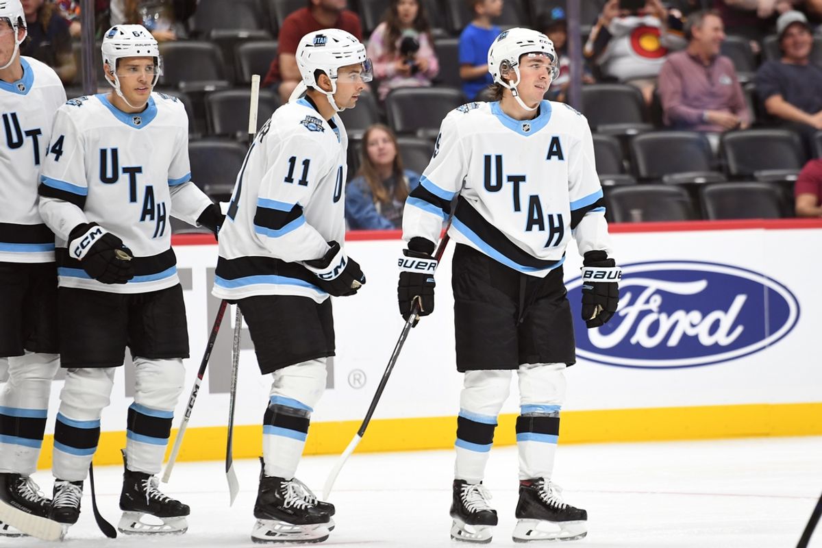 Sep 29, 2024; Denver, Colorado, USA; Utah Hockey Club forward Clayton Keller (9) celebrates with teammates after a goal during the third period against the Colorado Avalanche at Ball Arena. Mandatory Credit: Christopher Hanewinckel-Imagn Images