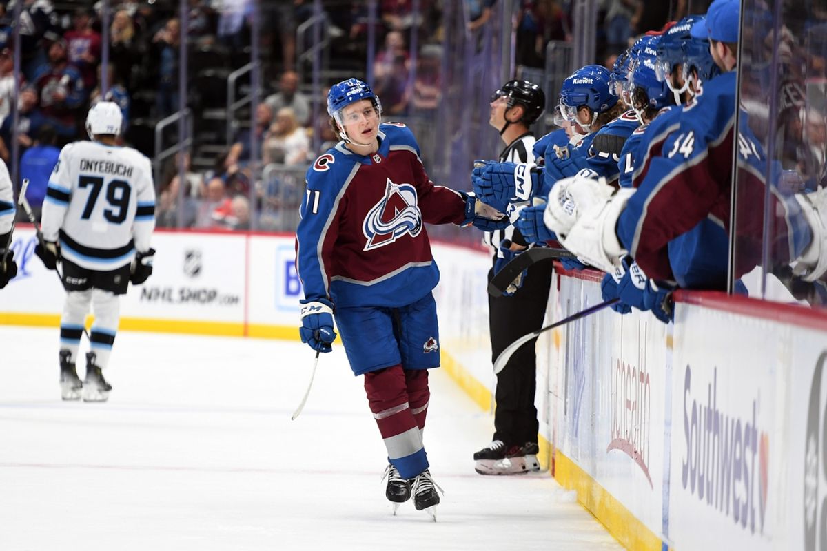 Sep 29, 2024; Denver, Colorado, USA; Colorado Avalanche center Calum Ritchie (71) celebrates with teammates after a goal during the third period against the Utah Hockey Club at Ball Arena. Mandatory Credit: Christopher Hanewinckel-Imagn Images