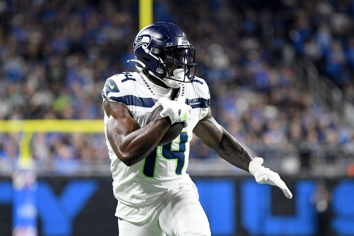 Sep 30, 2024; Detroit, Michigan, USA; Seattle Seahawks wide receiver DK Metcalf (14) runs with the ball against the Detroit Lions in the second quarter at Ford Field. Mandatory Credit: Eamon Horwedel-Imagn Images