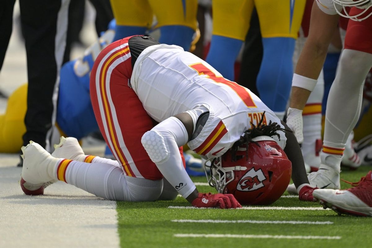 Sep 29, 2024; Inglewood, California, USA;  Kansas City Chiefs wide receiver Rashee Rice (4) pounds his fist on the ground after an injury in the first half against the Los Angeles Chargers at SoFi Stadium. Mandatory Credit: Jayne Kamin-Oncea-Imagn Images