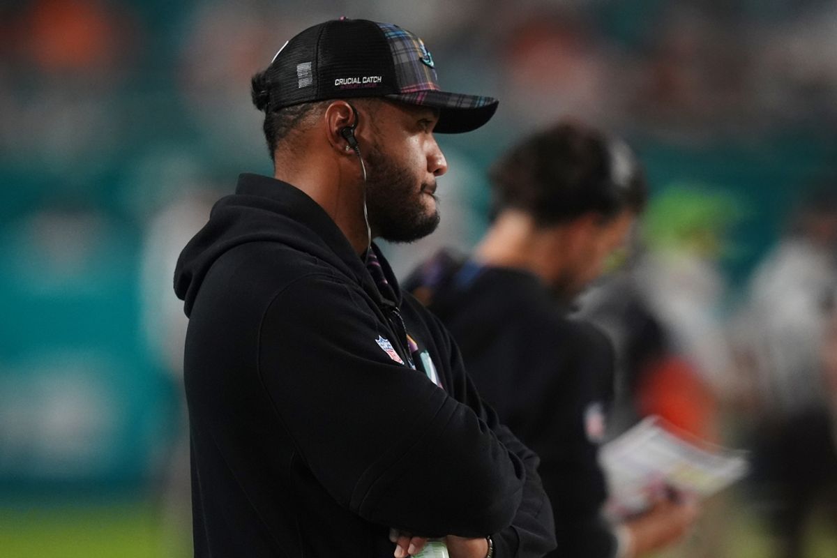 Sep 30, 2024; Miami Gardens, Florida, USA; Miami Dolphins quarterback Tua Tagovailoa stands on the sidelines during the second half against the Tennessee Titans at Hard Rock Stadium. Mandatory Credit: Jasen Vinlove-Imagn Images