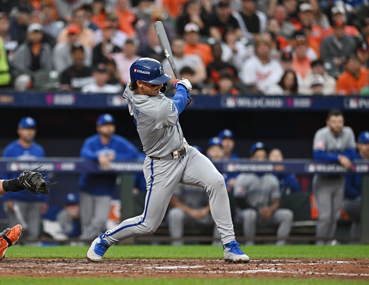 Oct 1, 2024; Baltimore, Maryland, USA; Kansas City Royals shortstop Bobby Witt Jr. (7) hits a RBI single at bat in the sixth inning in game one of the Wild Card round for the 2024 MLB Playoffs at Oriole Park at Camden Yards. Mandatory Credit: Tommy Gilligan-Imagn Images
