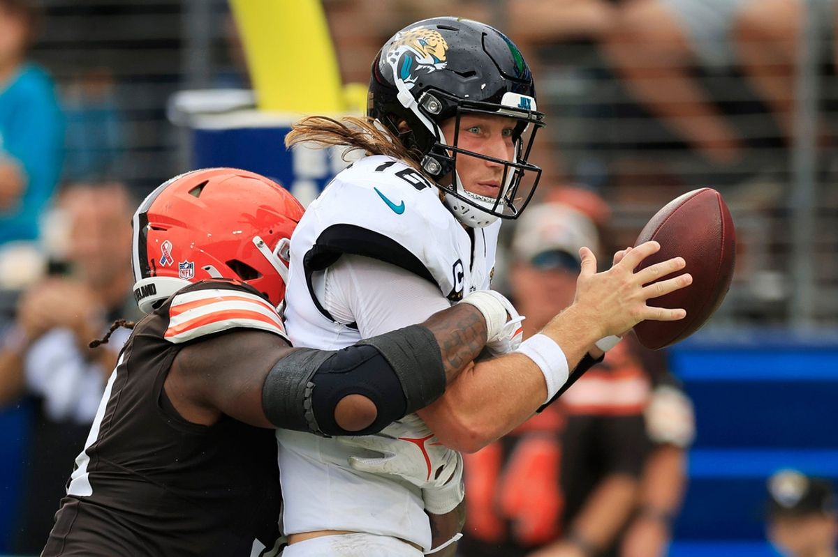 Cleveland Browns defensive end Alex Wright (91) sacks Jacksonville Jaguars quarterback Trevor Lawrence (16) in the end zone for a safety during the fourth quarter of an NFL football matchup Sunday, Sept. 15, 2024 at EverBank Stadium in Jacksonville, Fla. The Browns defeated the Jaguars 18-13.