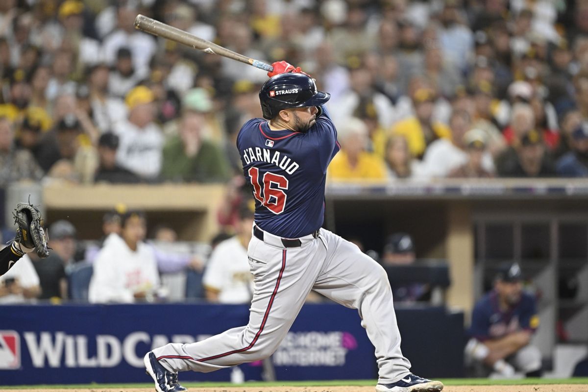 Oct 1, 2024; San Diego, California, USA; Atlanta Braves catcher Travis d'Arnaud (16) hits a double against the San Diego Padres during the fourth inning in game one of the Wildcard round for the 2024 MLB Playoffs at Petco Park. Mandatory Credit: Denis Poroy-Imagn Images