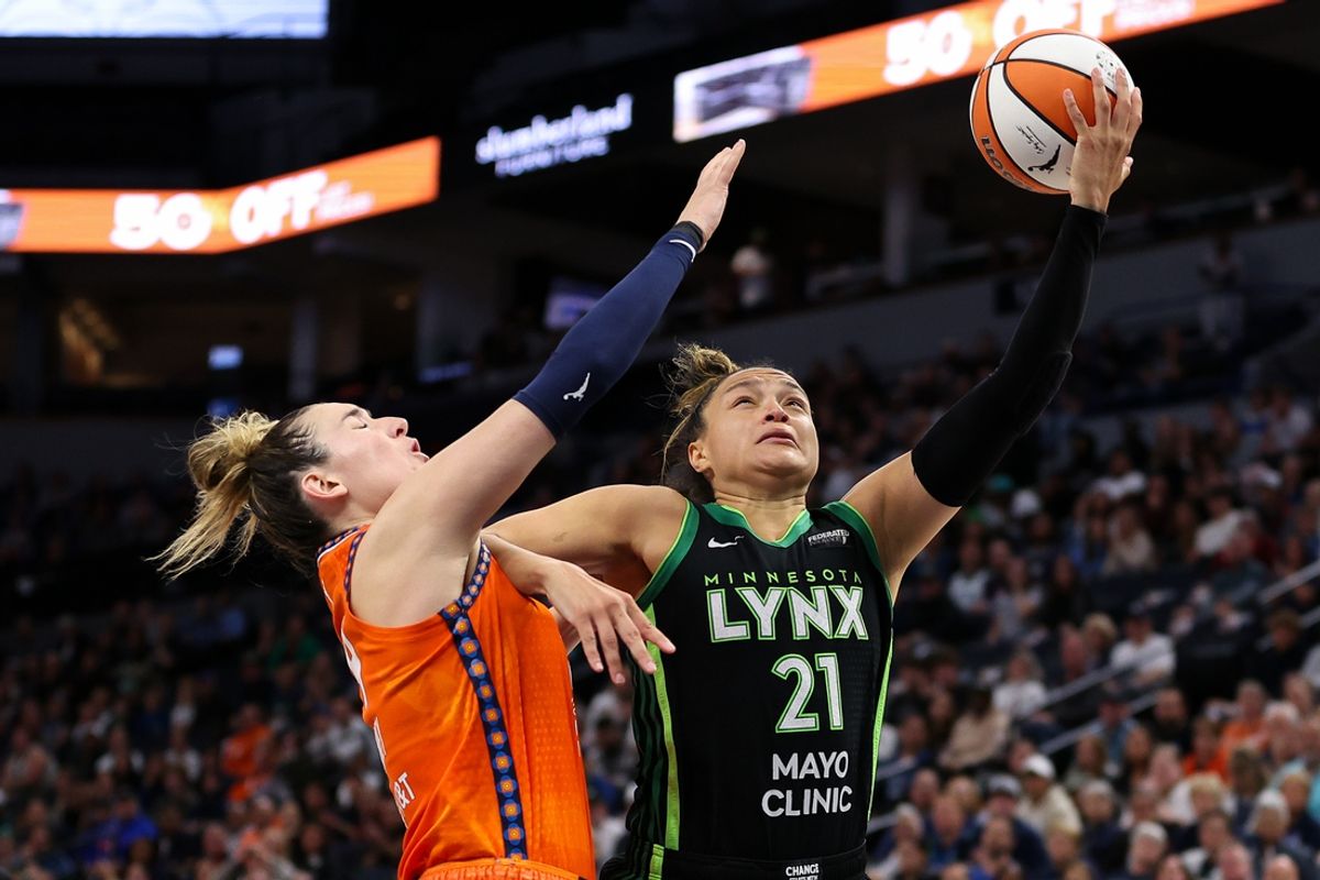 Oct 1, 2024; Minneapolis, Minnesota, USA; Minnesota Lynx guard Kayla McBride (21) shoots as Connecticut Sun guard Marina Mabrey (4) defends during the first half of game two of the 2024 WNBA Semi-finals at Target Center. Mandatory Credit: Matt Krohn-Imagn Images