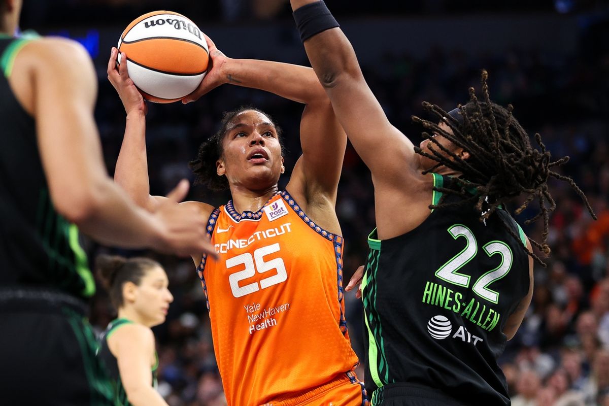 Oct 1, 2024; Minneapolis, Minnesota, USA; Connecticut Sun forward Alyssa Thomas (25) shoots as Minnesota Lynx forward Myisha Hines-Allen (22) defends during the second half of game two of the 2024 WNBA Semi-finals at Target Center. Mandatory Credit: Matt Krohn-Imagn Images