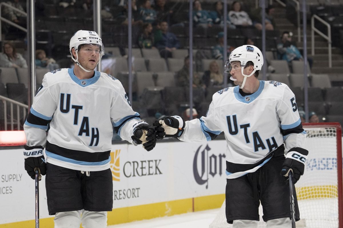 Oct 1, 2024; San Jose, California, USA; Utah Hockey Club forward Barrett Hayton (27) celebrates a goal with forward Kailer Yamamoto (56) during the third period against the San Jose Sharks at SAP Center at San Jose. Mandatory Credit: Stan Szeto-Imagn Images
