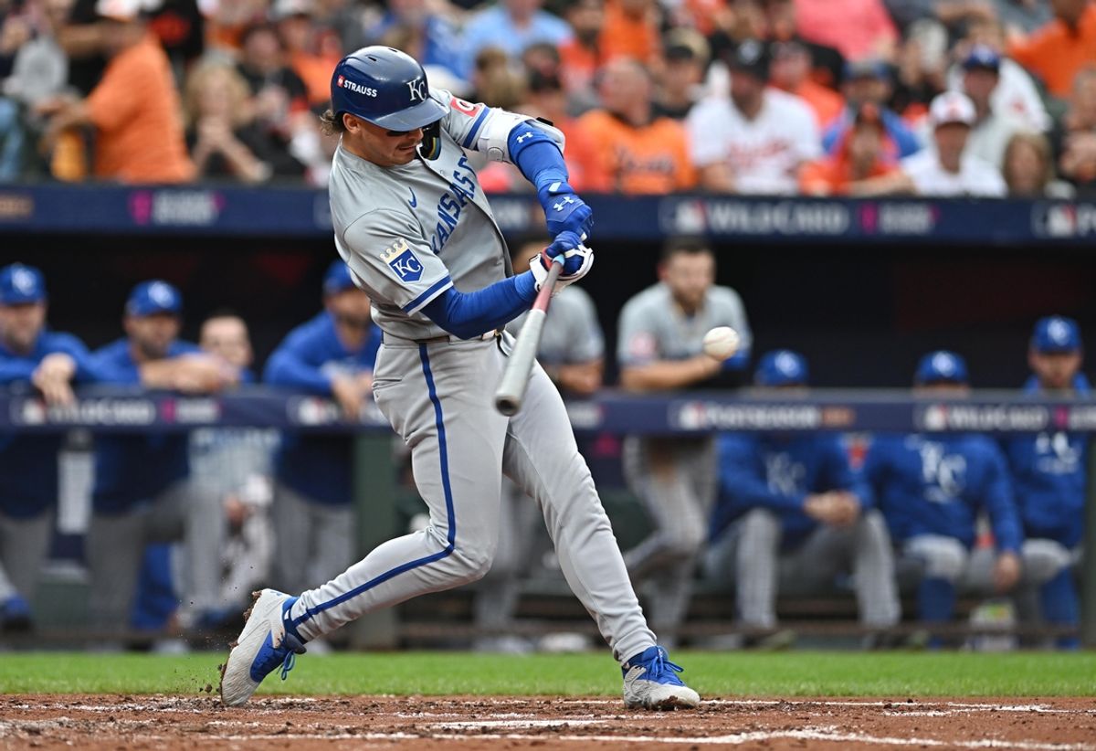 Oct 2, 2024; Baltimore, Maryland, USA; Kansas City Royals shortstop Bobby Witt Jr. (7) hits a single in the third inning against the Baltimore Orioles in game two of the Wild Card round for the 2024 MLB Playoffs at Oriole Park at Camden Yards. Mandatory Credit: Tommy Gilligan-Imagn Images