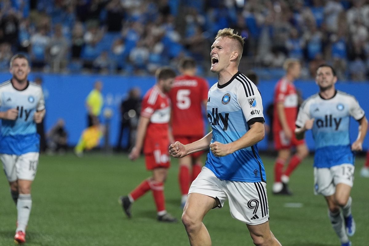Oct 2, 2024; Charlotte, North Carolina, USA; Charlotte FC forward Karol Swiderski (9) reacts to his goal against Chicago Fire FC during the first half at Bank of America Stadium. Mandatory Credit: Jim Dedmon-Imagn Images
