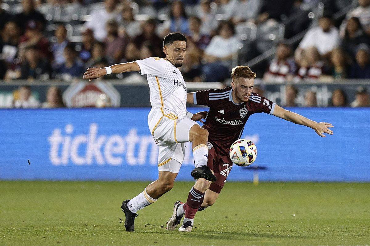 Oct 2, 2024; Commerce City, Colorado, USA; Colorado Rapids midfielder Connor Ronan (20) kicks the ball against the LA Galaxy during the first half at Dick's Sporting Goods Park. Mandatory Credit: Isaiah J. Downing-Imagn Images