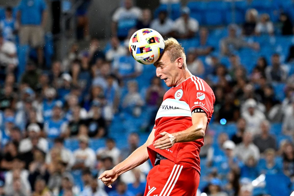 Oct 2, 2024; Charlotte, North Carolina, USA; Chicago Fire defender Tobias Salquist (14) heads the ball in the second half at Bank of America Stadium. Mandatory Credit: Bob Donnan-Imagn Images