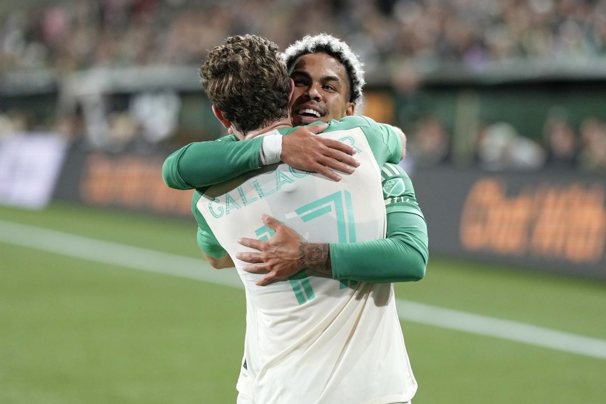 Oct 2, 2024; Portland, Oregon, USA; Austin FC midfielder Dani Pereira (6) celebrates with Austin FC defender Jon Gallagher (17) after scoring a goal against the Portland Timbers during the first half at Providence Park. Mandatory Credit: Soobum Im-Imagn Images