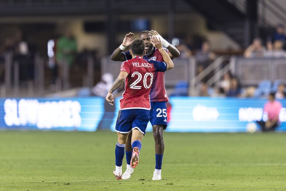 Oct 2, 2024; San Jose, California, USA; FC Dallas forward Alan Velasco (20) is congratulated by defender Sebastien Ibeagha (25) after he scored against the San Jose Earthquakes during the first half at PayPal Park. Mandatory Credit: John Hefti-Imagn Images