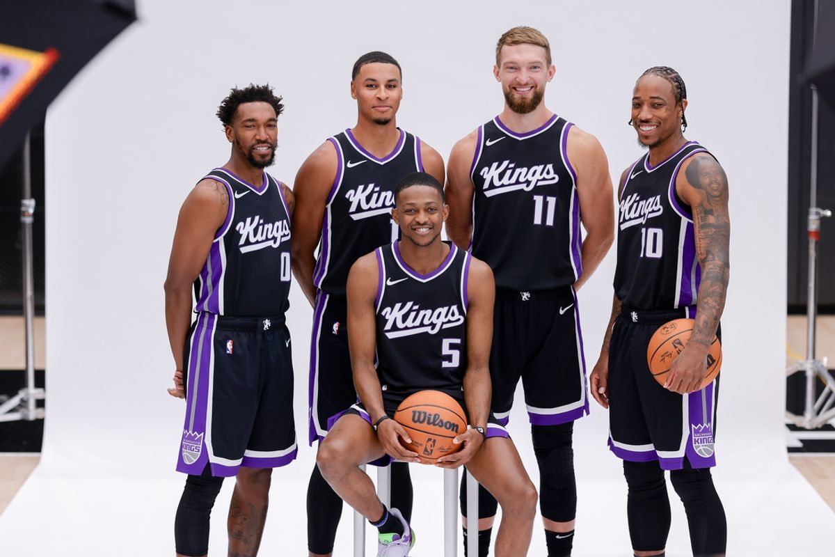 Sep 30, 2024; Sacramento, CA, USA; Sacramento Kings guard Malik Monk (0) and forward Keegan Murray (13) and forward Domantas Sabonis (11) and forward DeMar DeRozan (10) and guard De'Aaron Fox (5) pose for a photo during media day at Golden 1 Center. Mandatory Credit: Sergio Estrada-Imagn Images