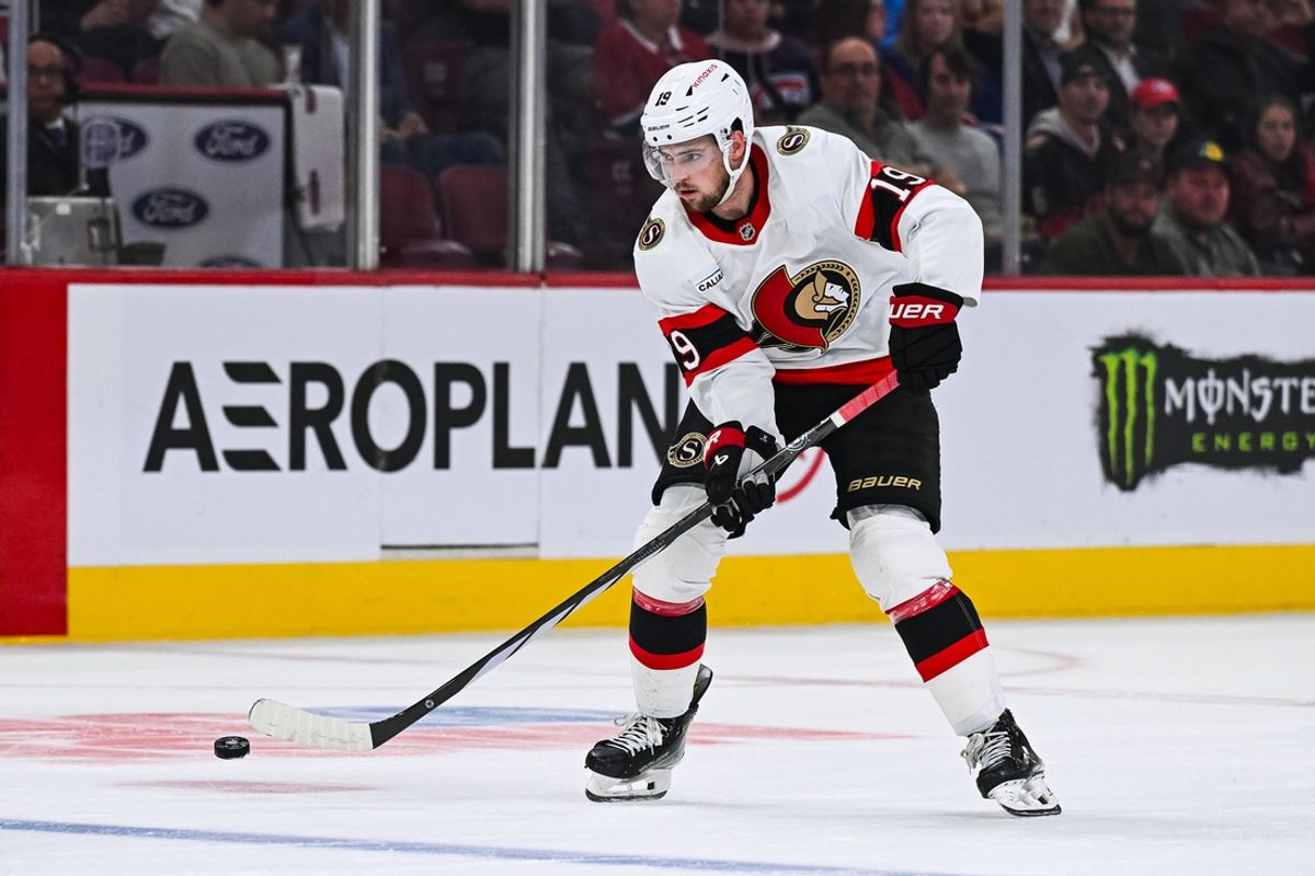 Oct 1, 2024; Montreal, Quebec, CAN; Ottawa Senators right wing Drake Batherson (19) plays the puck against the Montreal Canadiens during the third period at Bell Centre. Mandatory Credit: David Kirouac-Imagn Images
